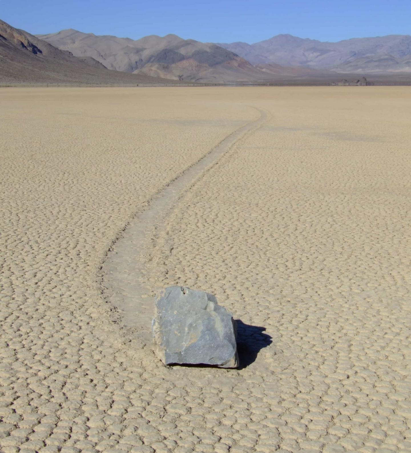 Giant rocks have been moving across the sand of the waterless lake, seemingly of their own accord